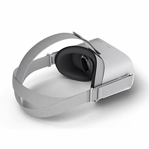 Side view of a gray virtual reality headset with adjustable straps.